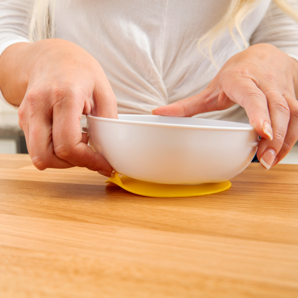 https://cdn.shopify.com/s/files/1/0659/5860/9120/products/Lifestyle_No_Slip_Suction_Bowl_On_Counter_Pull_Tab_Yellow_Front-1-600x600.png?v=1676271497